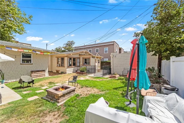 a front view of a house with swimming pool garden and patio