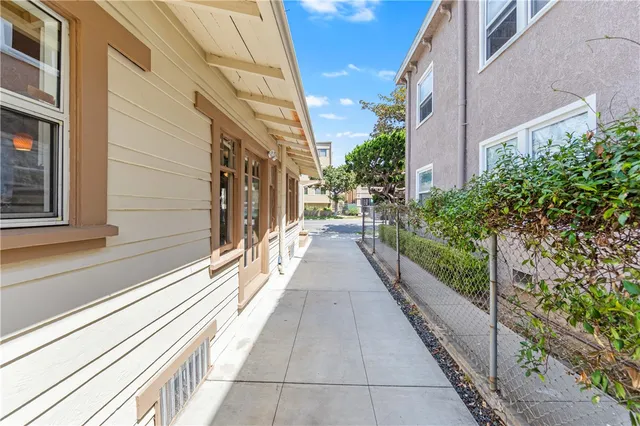 a view of a pathway both side of house