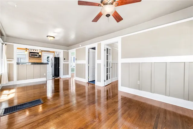 a view of an entryway with wooden floor