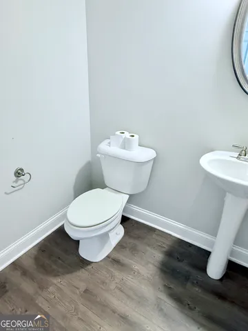 a bathroom with a toilet and a sink