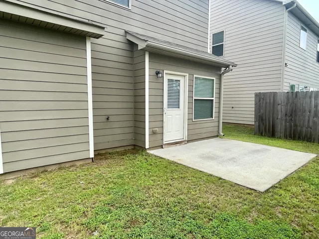 a view of a backyard of the house