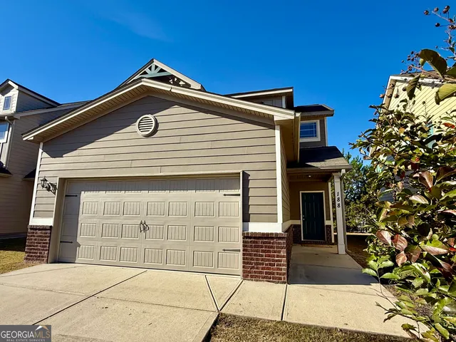 a front view of a house with a garage