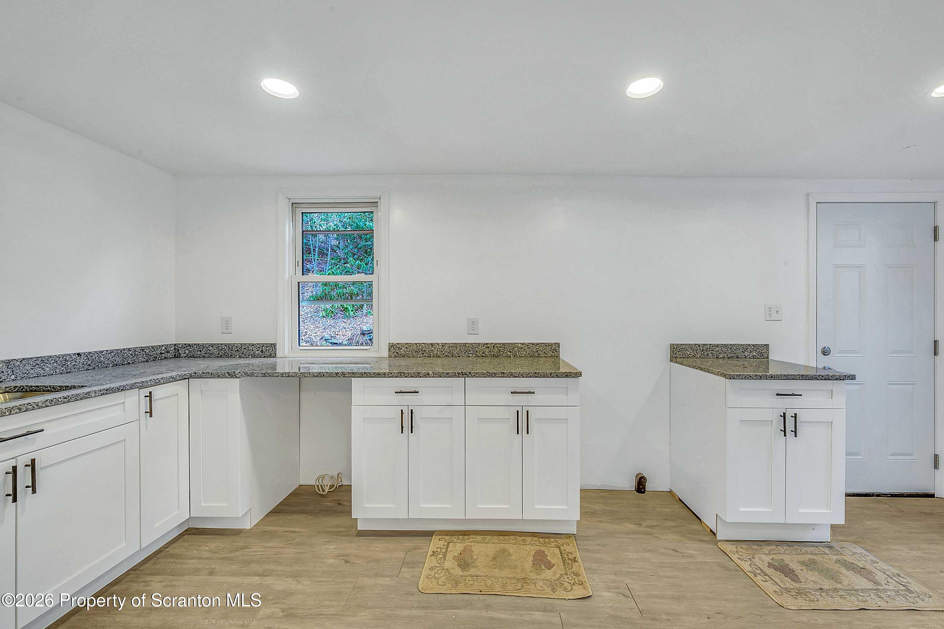 602 Main Street Archbald, PA 18403 - Photo 11 of 26 a view of cabinets a wooden floor and a sink
