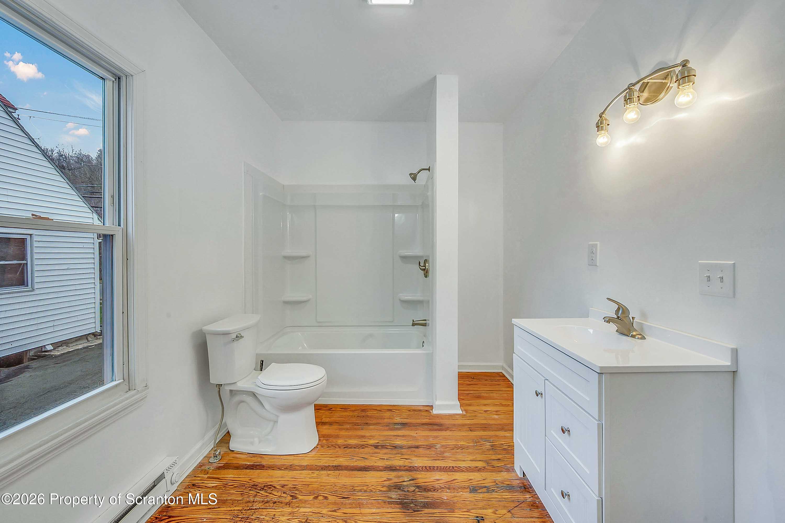 602 Main Street Archbald, PA 18403 - Photo 12 of 26 a bathroom with a sink toilet and shower