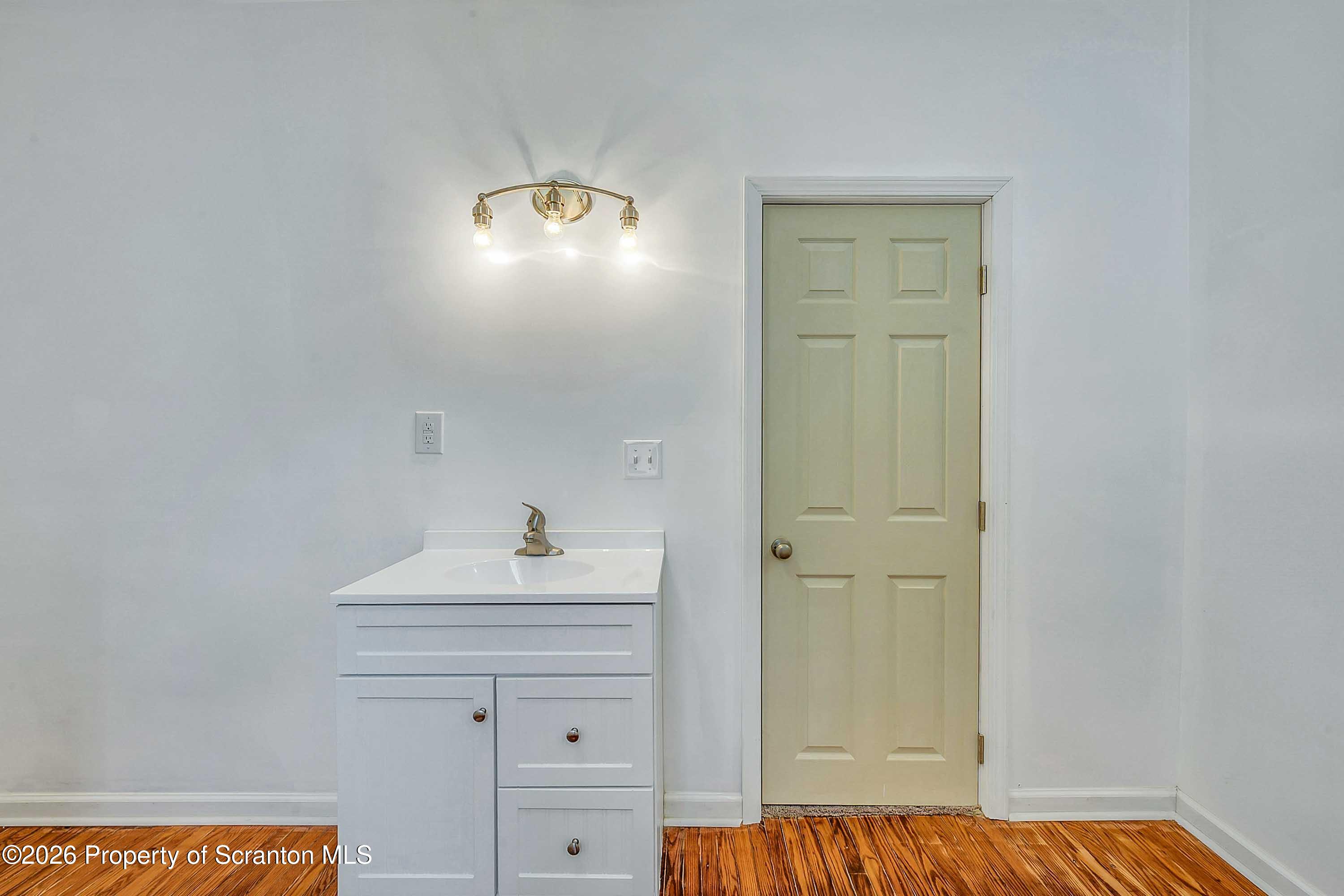 602 Main Street Archbald, PA 18403 - Photo 13 of 26 a bathroom with a sink and a mirror