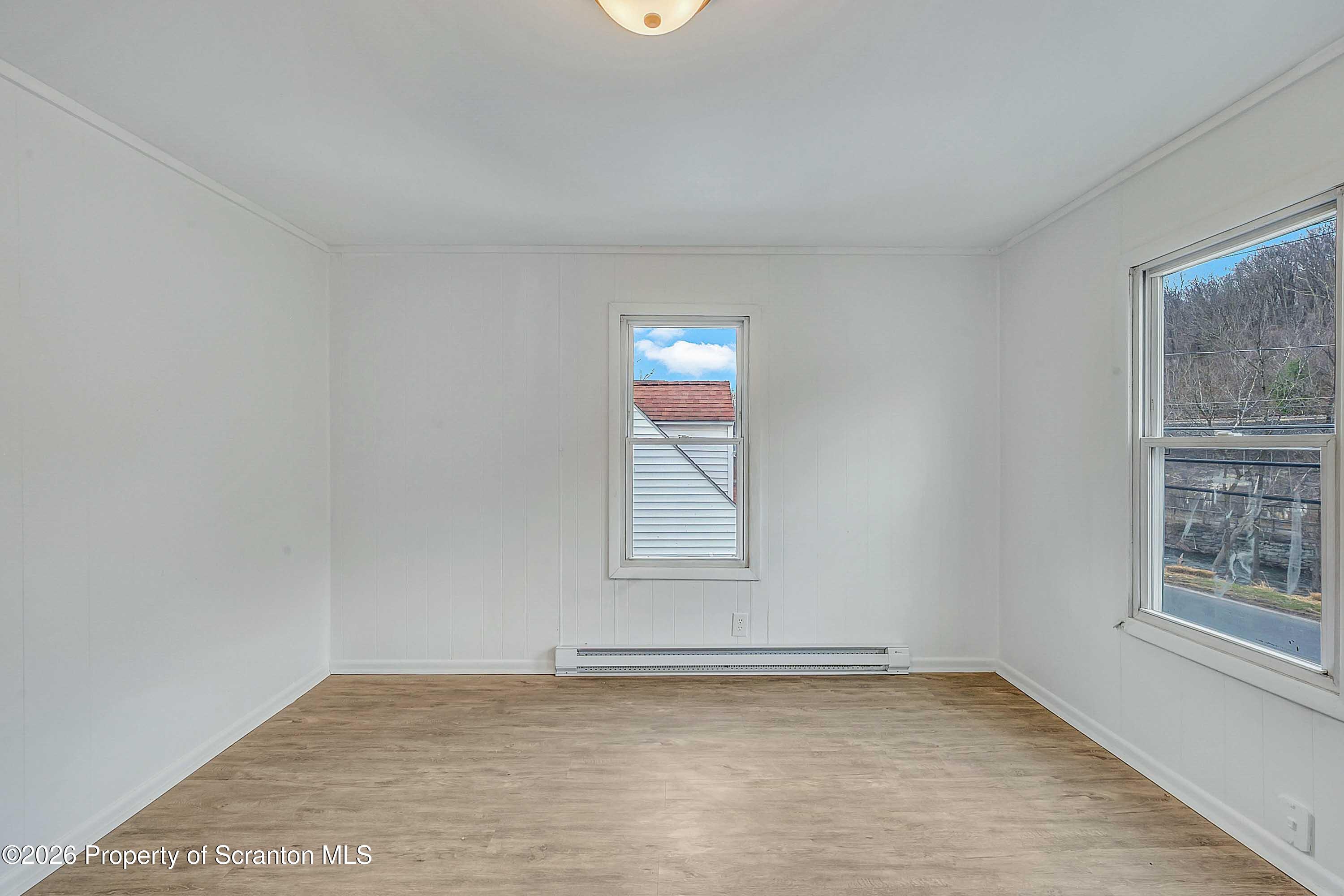 602 Main Street Archbald, PA 18403 - Photo 17 of 26 an empty room with windows