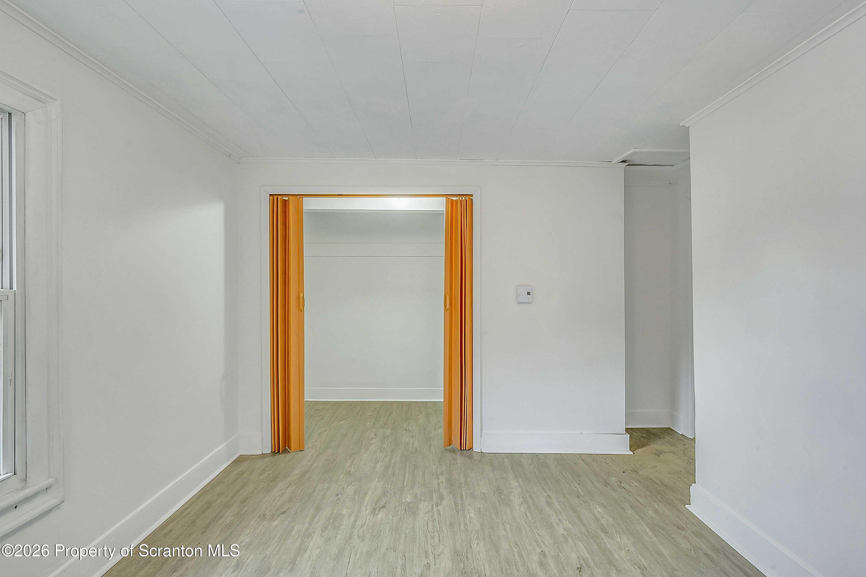 602 Main Street Archbald, PA 18403 - Photo 20 of 26 a view of an empty room with wooden floor and closet