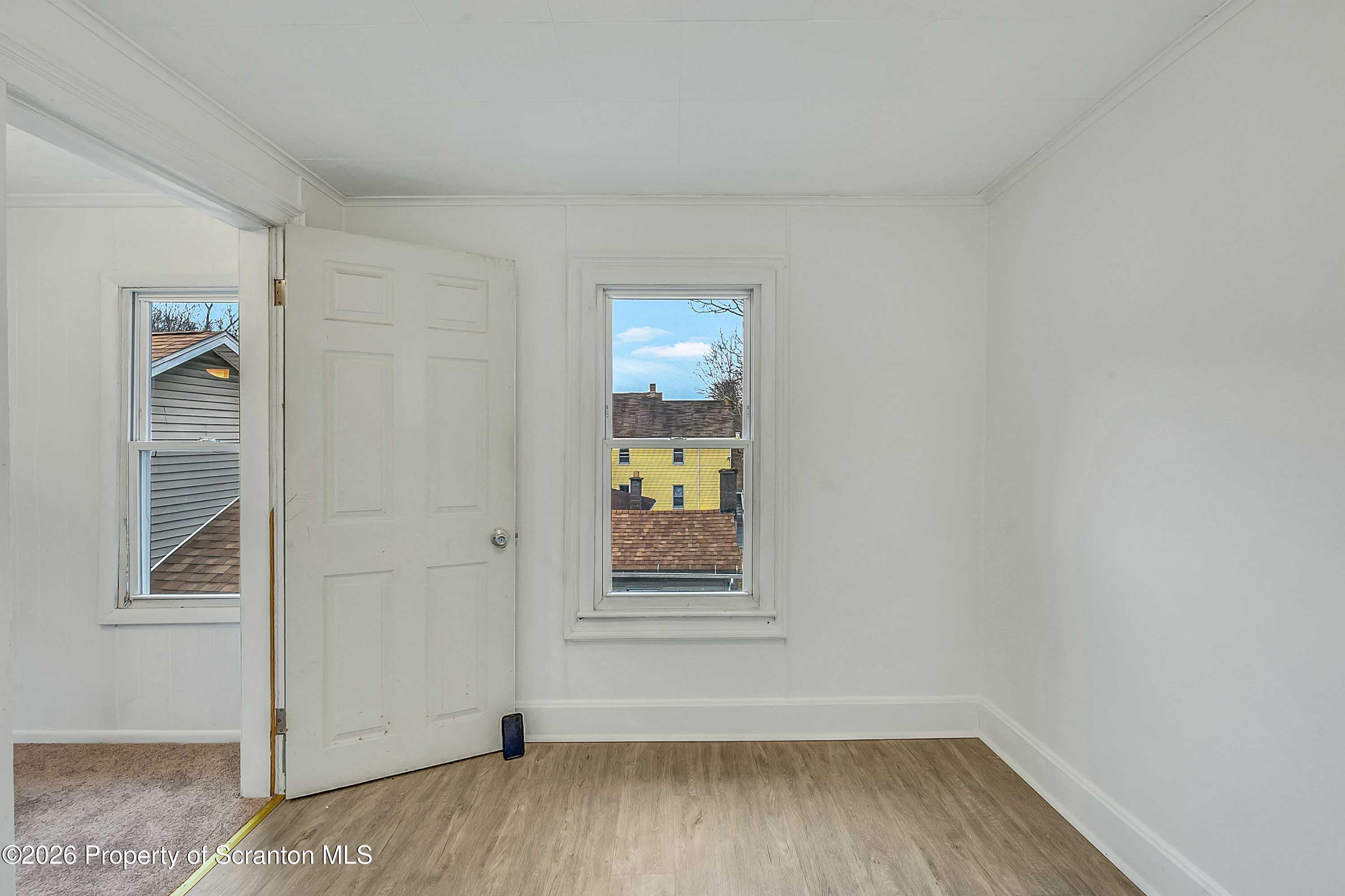 602 Main Street Archbald, PA 18403 - Photo 22 of 26 an empty room with a window