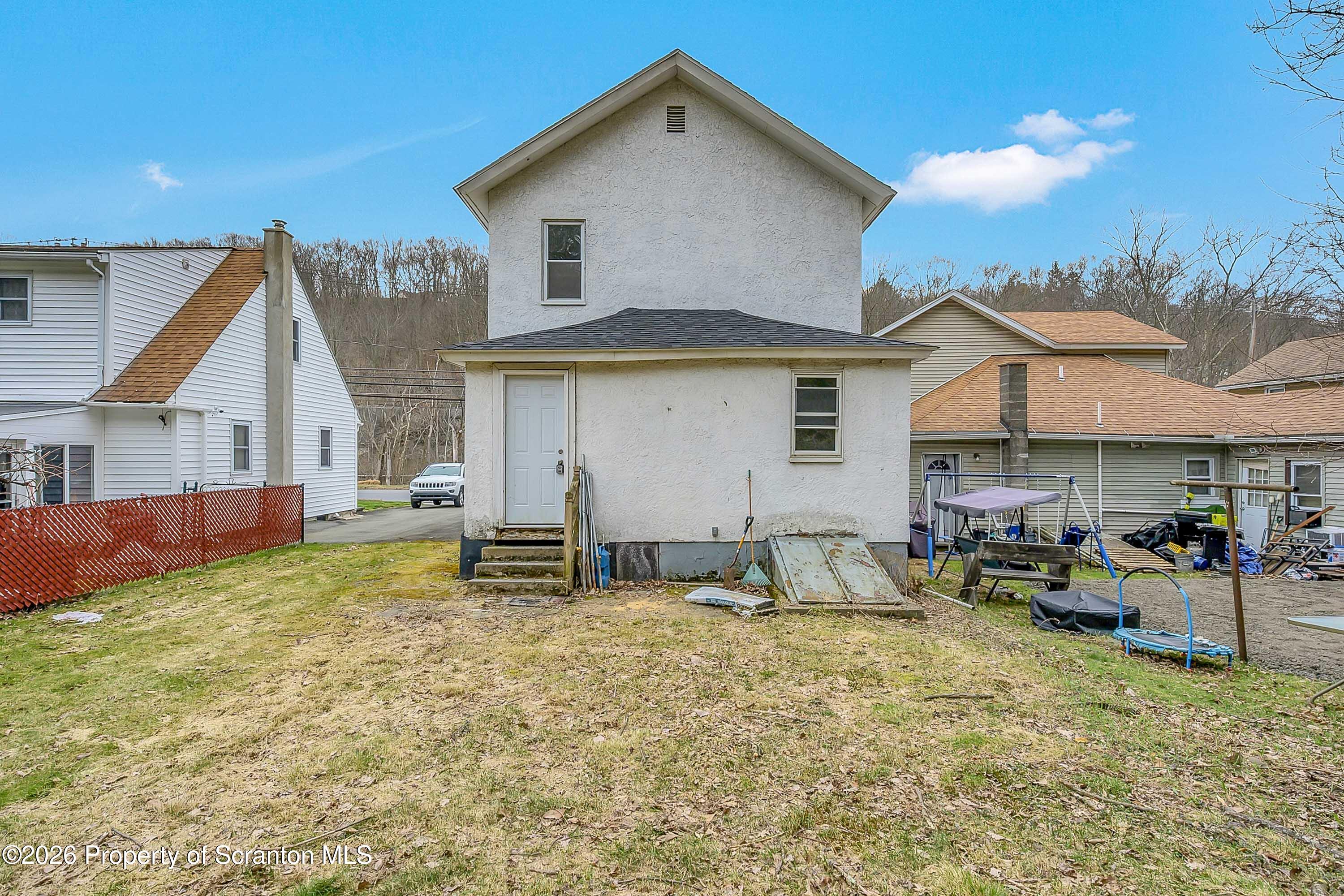 602 Main Street Archbald, PA 18403 - Photo 24 of 26 a view of a house with backyard and sitting area