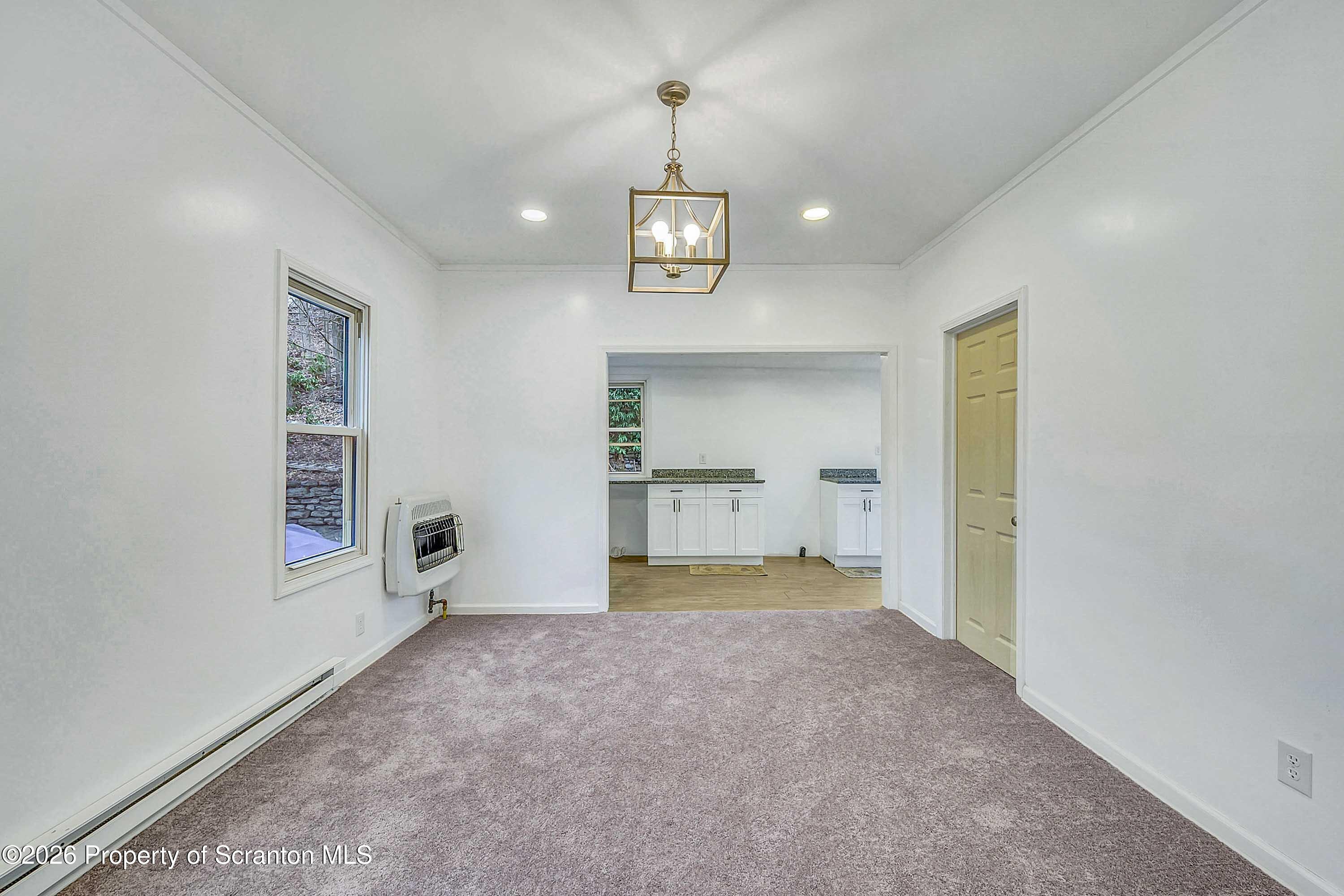602 Main Street Archbald, PA 18403 - Photo 8 of 26 a view of an empty room and a window