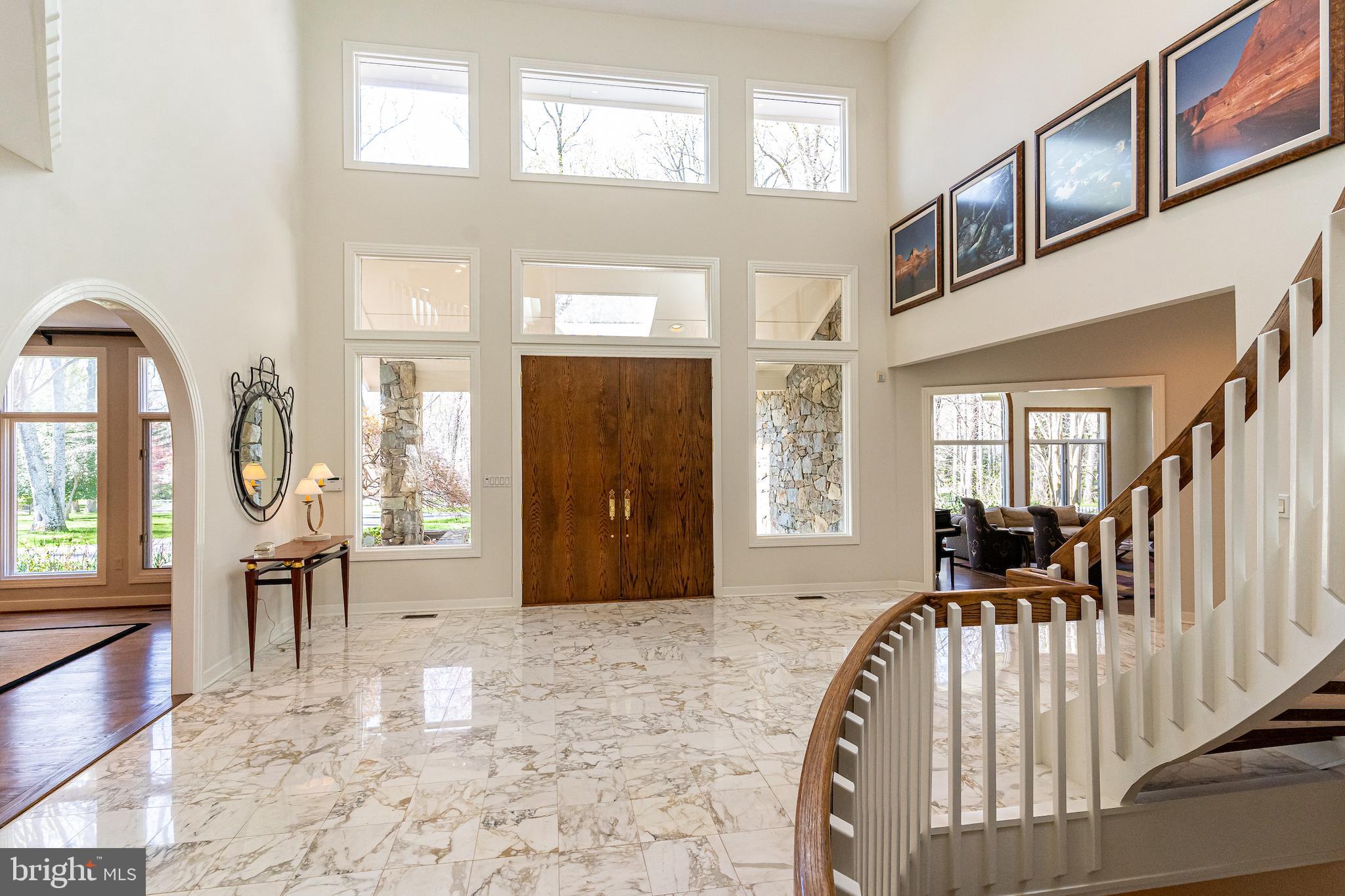 9129 Persimmon Tree Road Potomac, MD 20854 - Photo 6 of 51 Sun Drenched Foyer w/ Wall of Windows