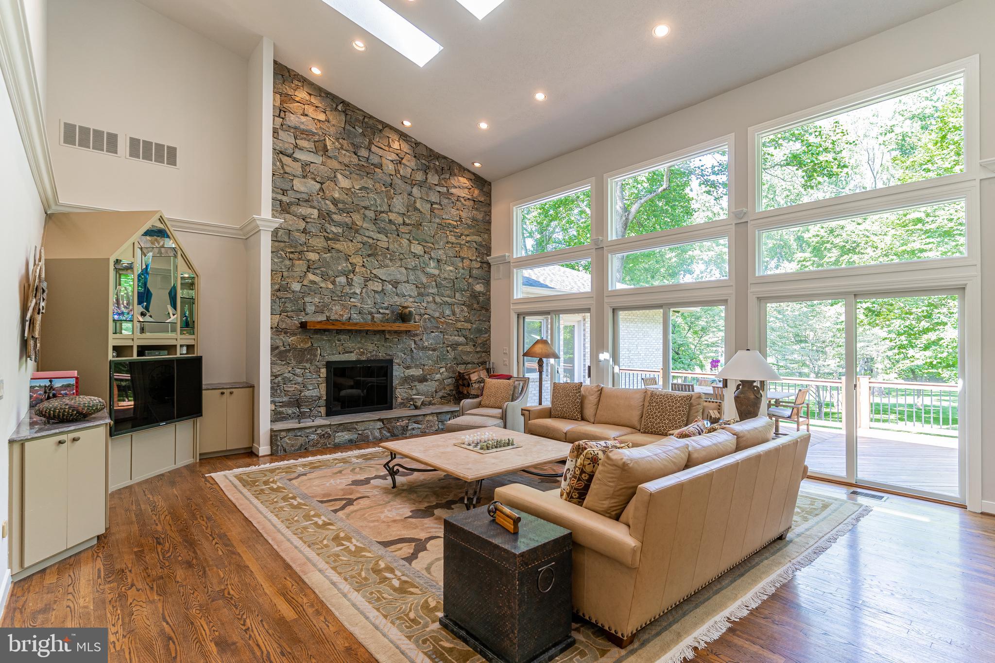 9129 Persimmon Tree Road Potomac, MD 20854 - Photo 8 of 51 Wall of Windows, Soaring Stone Fireplace