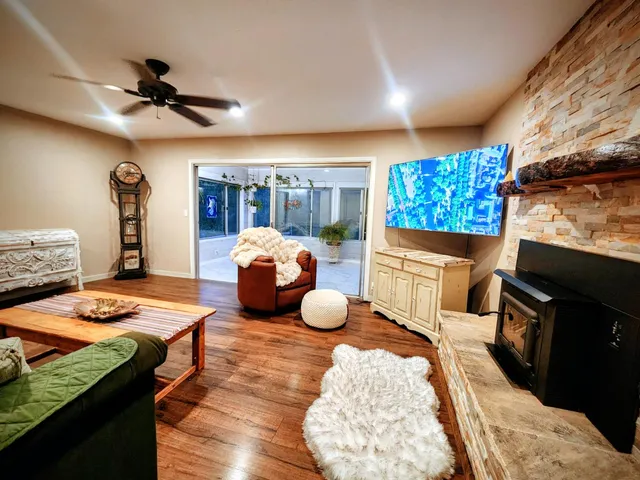 a view of balcony with furniture and wooden floor