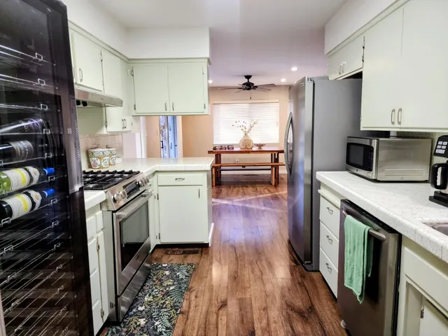 a bed room with a bed and a chandelier