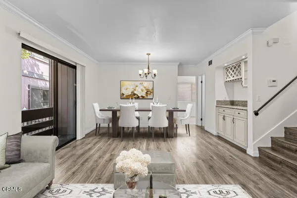 a view of a dining room with furniture window and wooden floor