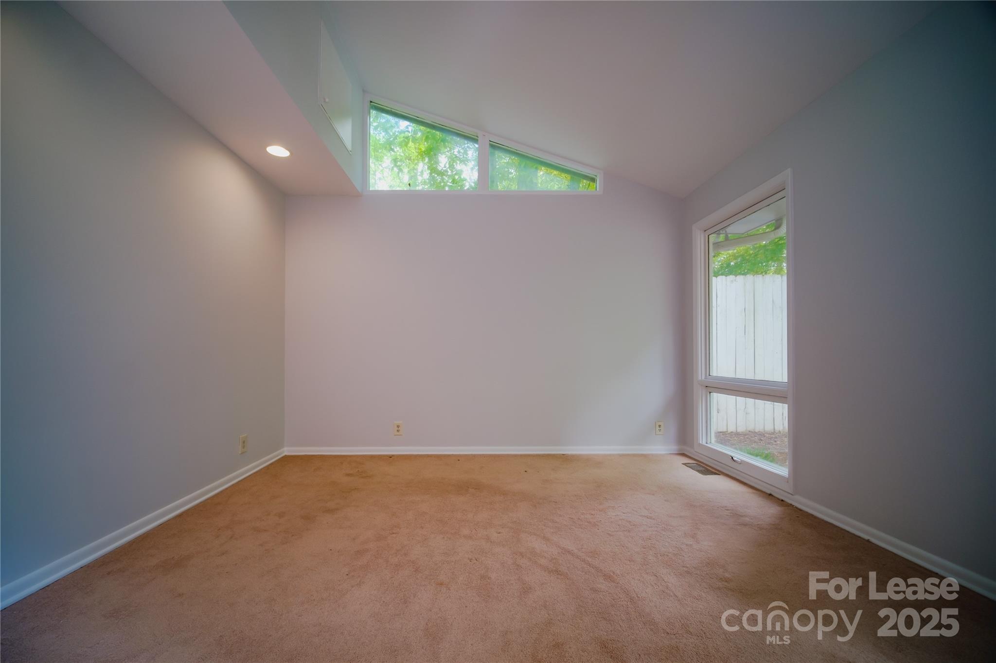 1123 Lynbrook Drive Charlotte, NC 28211 - Photo 13 of 47 an empty room with a window