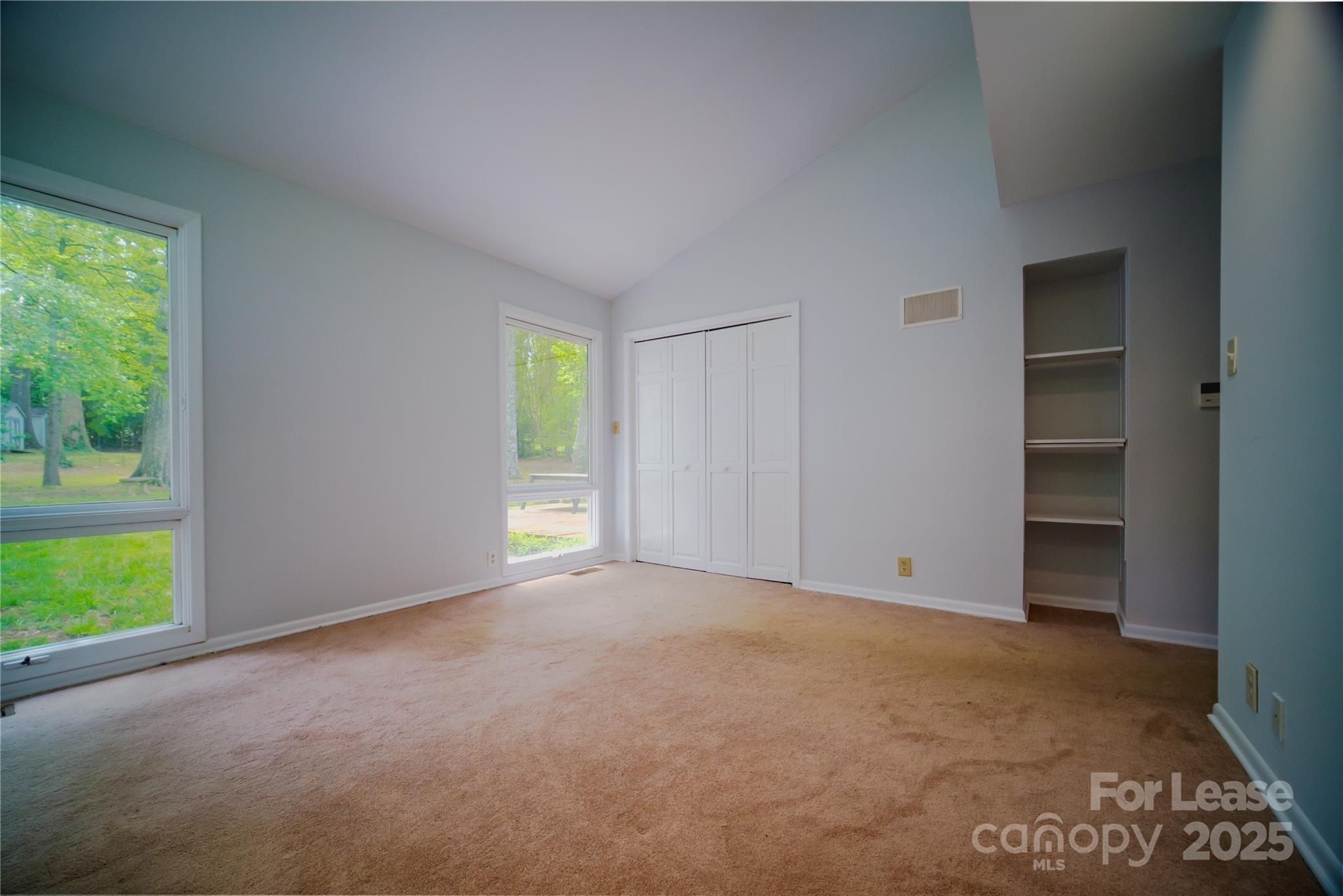 1123 Lynbrook Drive Charlotte, NC 28211 - Photo 14 of 47 an empty room with windows and closet