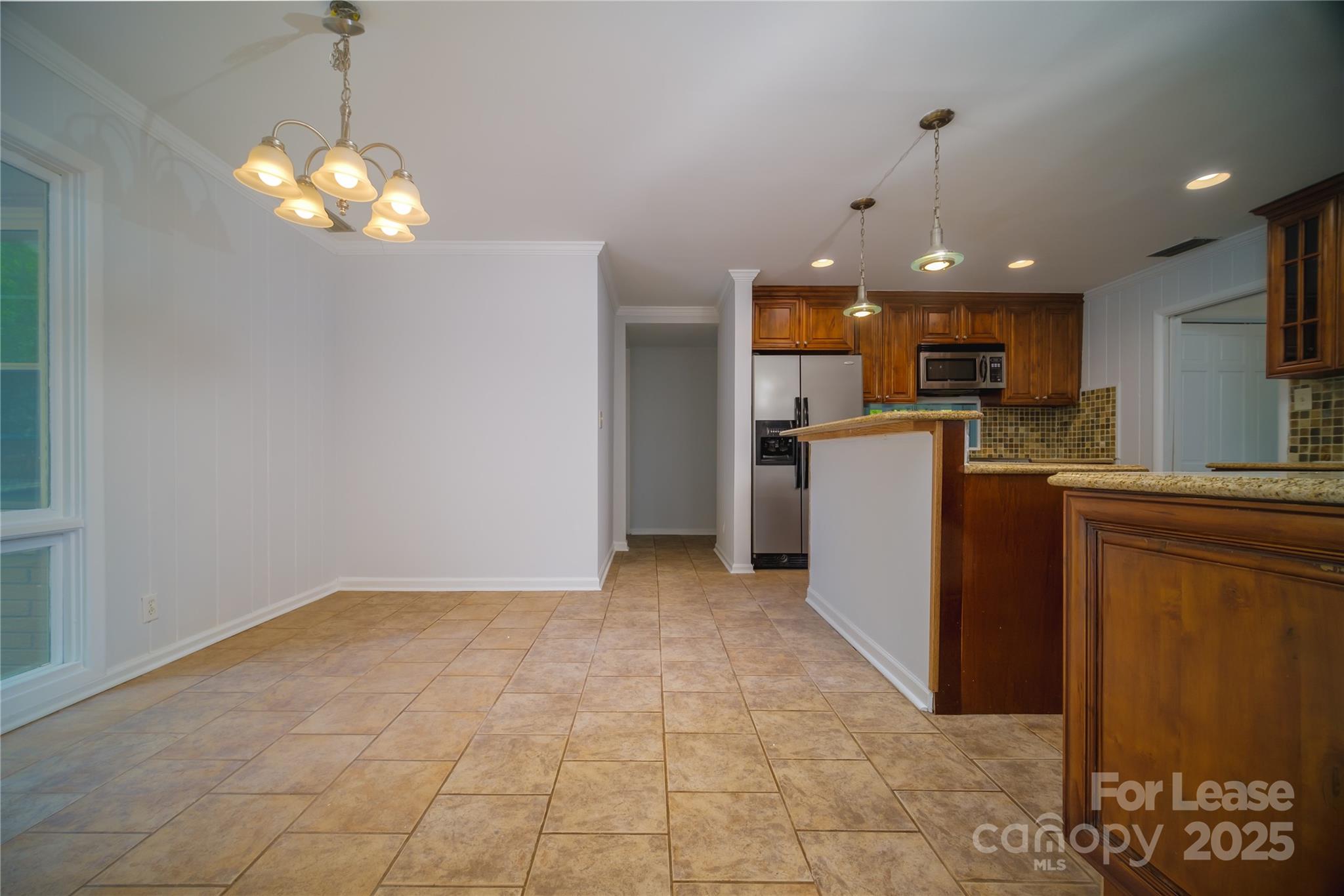1123 Lynbrook Drive Charlotte, NC 28211 - Photo 15 of 47 a view of a kitchen with a sink and a refrigerator
