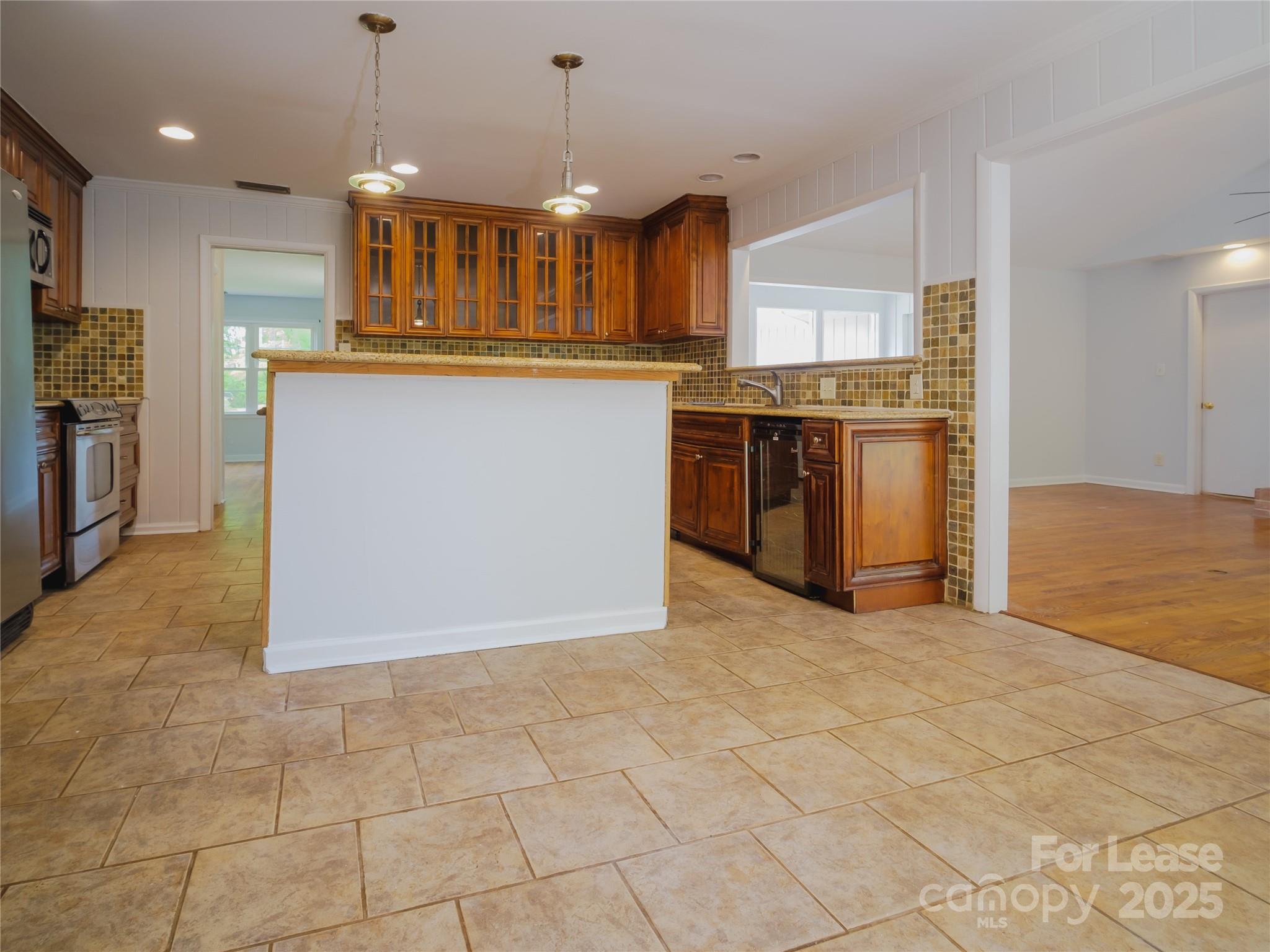 1123 Lynbrook Drive Charlotte, NC 28211 - Photo 17 of 47 a view of kitchen with stainless steel appliances granite countertop a stove top oven a sink a counter top space and cabinets
