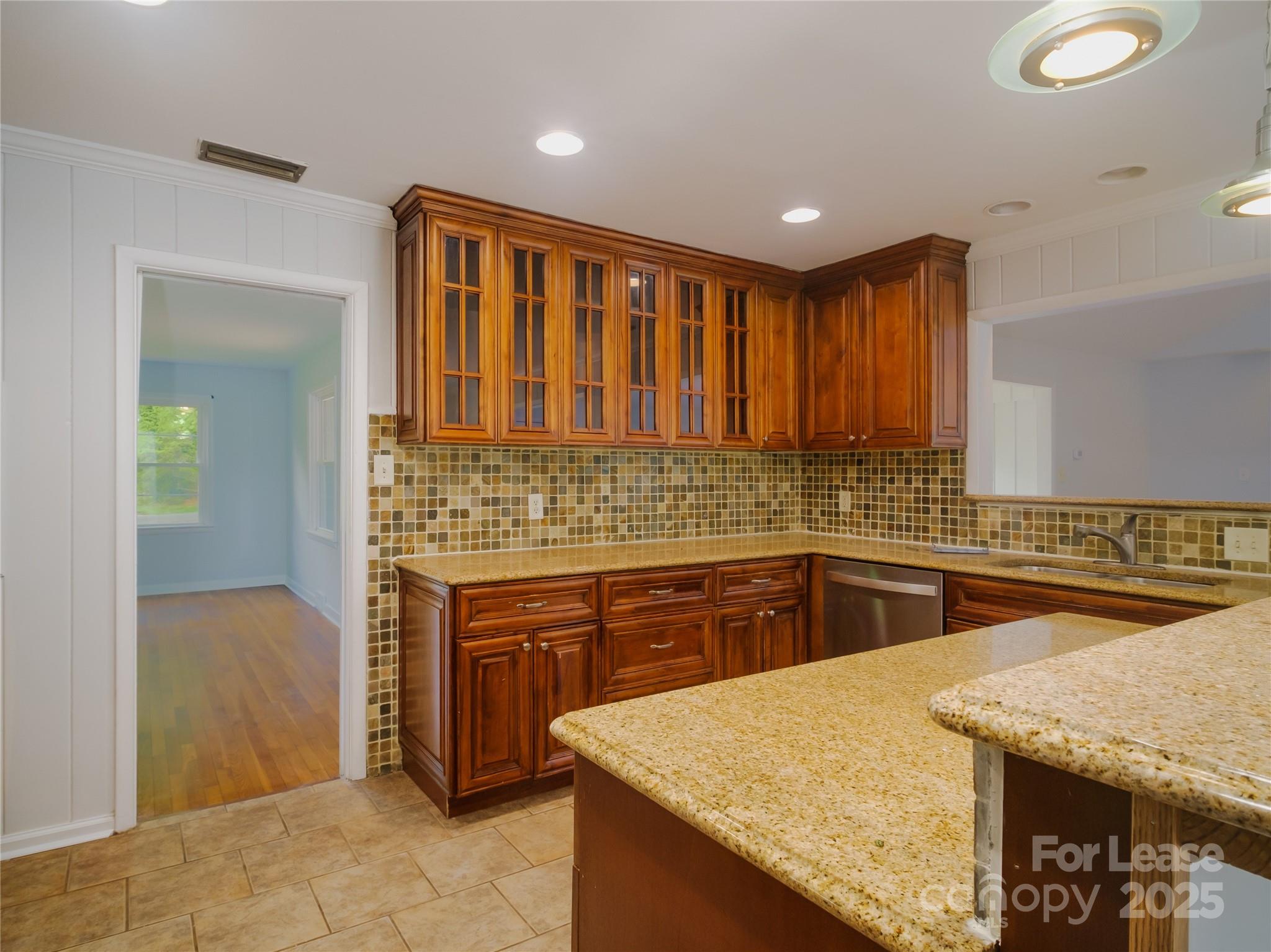 1123 Lynbrook Drive Charlotte, NC 28211 - Photo 18 of 47 a kitchen with stainless steel appliances granite countertop wooden cabinets a oven and granite counter tops