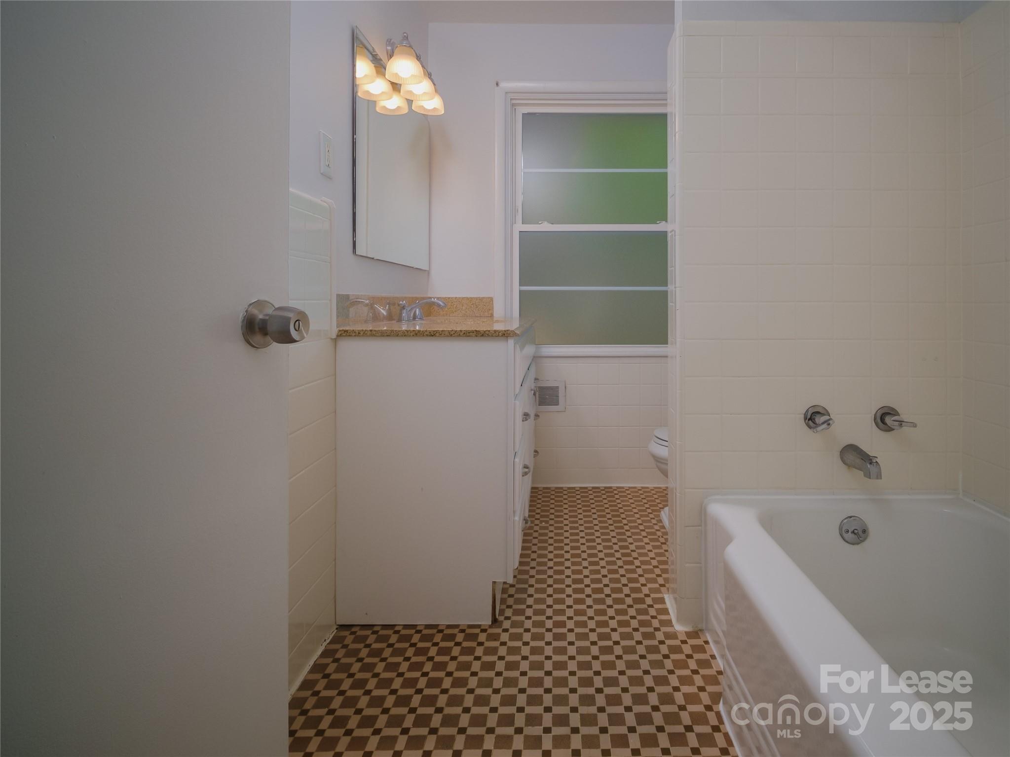 1123 Lynbrook Drive Charlotte, NC 28211 - Photo 33 of 47 a bathroom with a bathtub and a shower