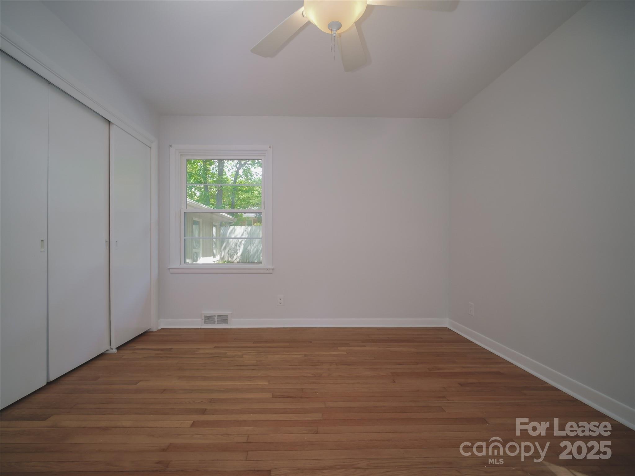 1123 Lynbrook Drive Charlotte, NC 28211 - Photo 39 of 47 a view of room with window and hardwood floor