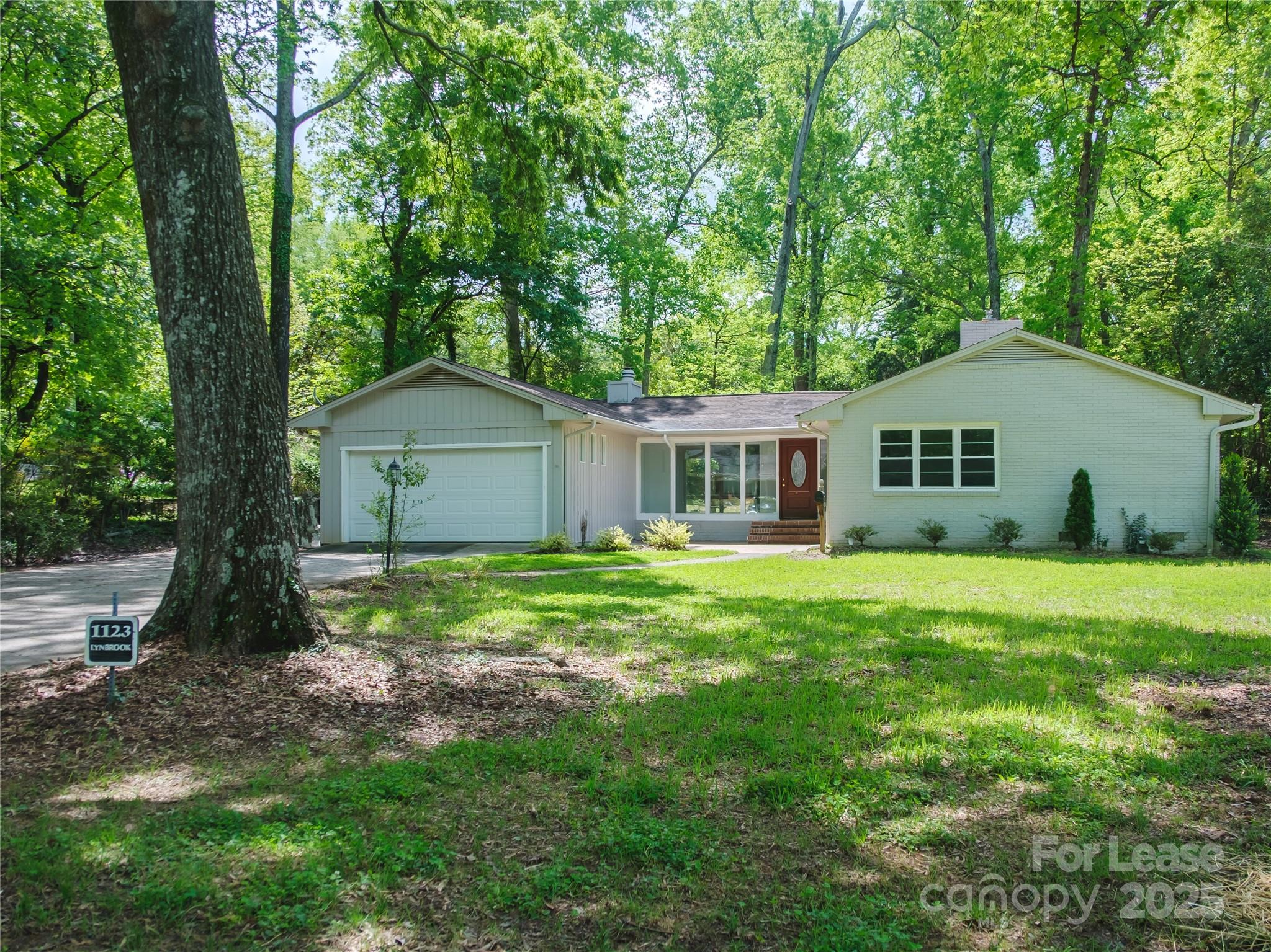 1123 Lynbrook Drive Charlotte, NC 28211 - Photo 41 of 47 a house view with a garden space