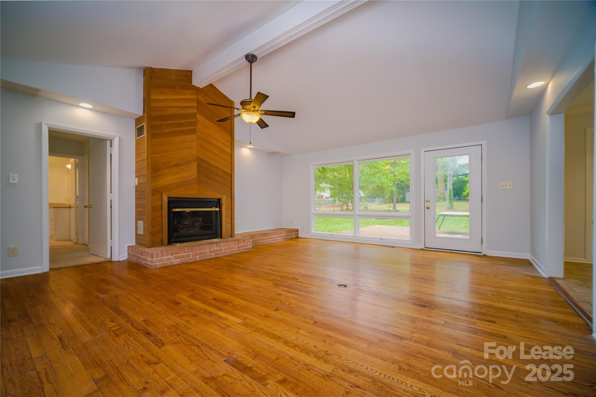 1123 Lynbrook Drive Charlotte, NC 28211 - Photo 7 of 47 a view of empty room with wooden floor and fan