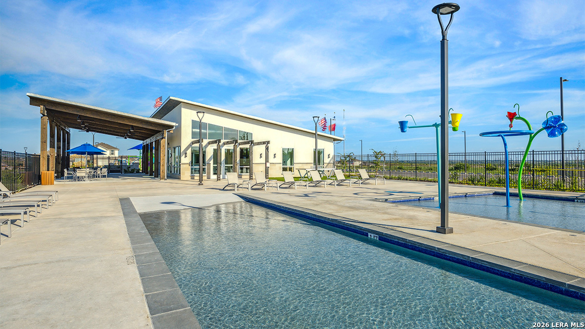 5007 Gecko Converse, TX 78109 - Photo 60 of 72 a view of a swimming pool with a lounge chairs