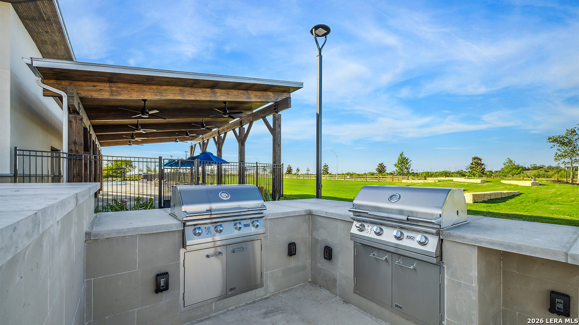 5007 Gecko Converse, TX 78109 - Photo 66 of 72 a open kitchen with stainless steel appliances granite countertop a stove a sink and a refrigerator