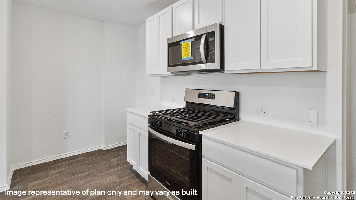 5007 Gecko Converse, TX 78109 - Photo 7 of 72 a kitchen with stainless steel appliances granite countertop a stove and a microwave
