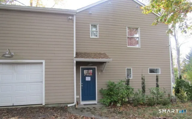 a view of a brick house with a large windows