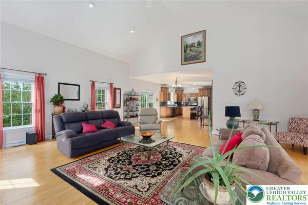 a living room with furniture and a rug