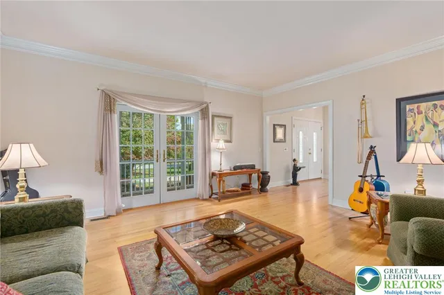 a living room with furniture windows and wooden floor