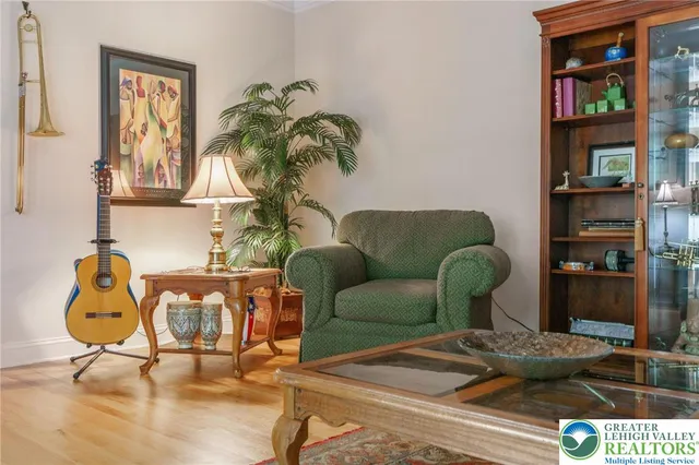 a bathroom with a granite countertop sink mirror vanity and a toilet