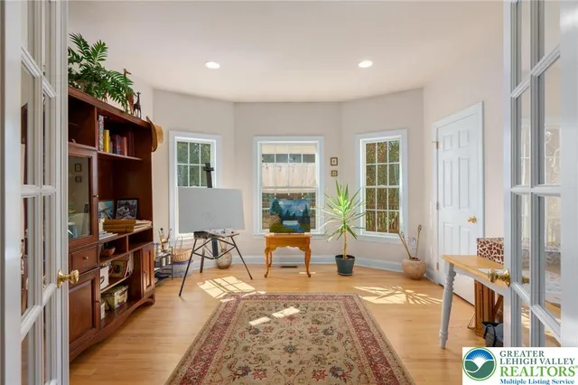 a bedroom with a bed couch and window