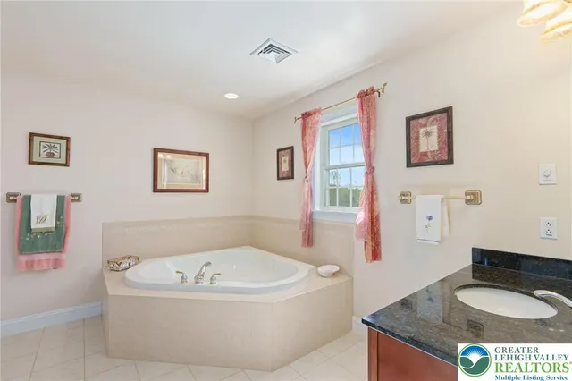 a bedroom with a large bed and a large window