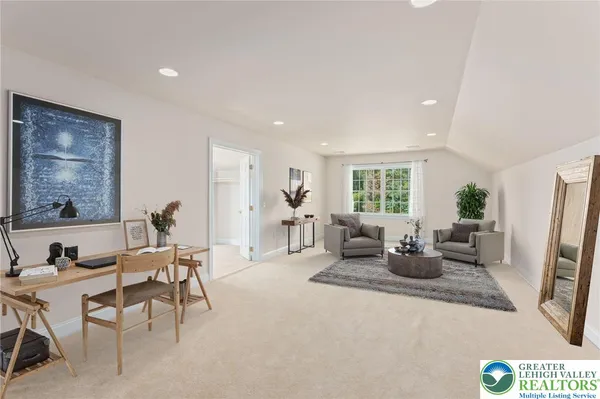 a spacious bedroom with a bed and a couch