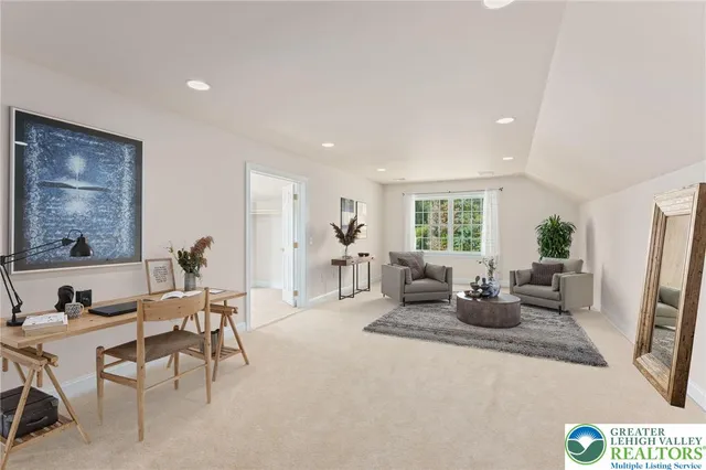 a spacious bedroom with a bed and a couch