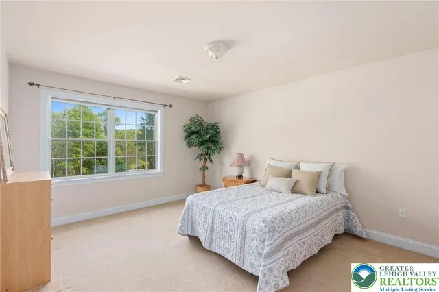 a view of a livingroom with furniture and windows