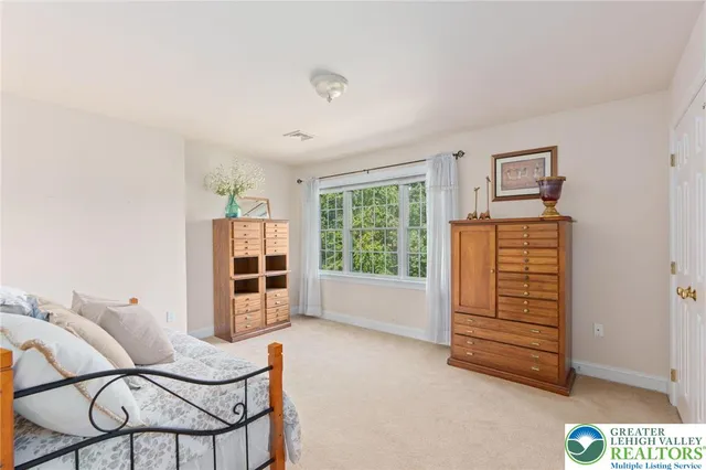 a room with furniture and white walls