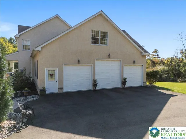 a view of a patio with table and chairs and potted plants