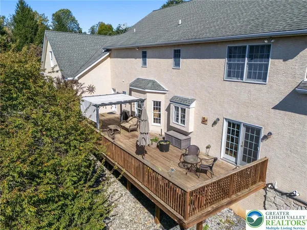 an aerial view of a house with mountain view