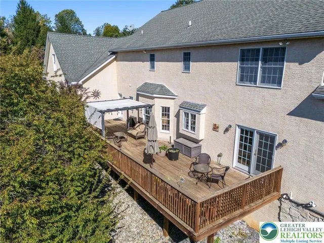 an aerial view of a house with mountain view