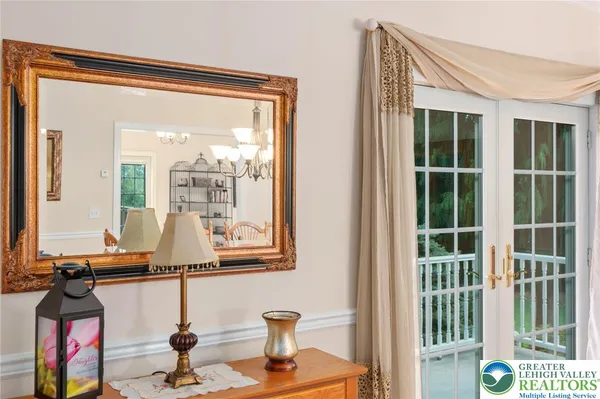 a living room with a large window and outer view