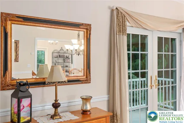 a living room with a large window and outer view