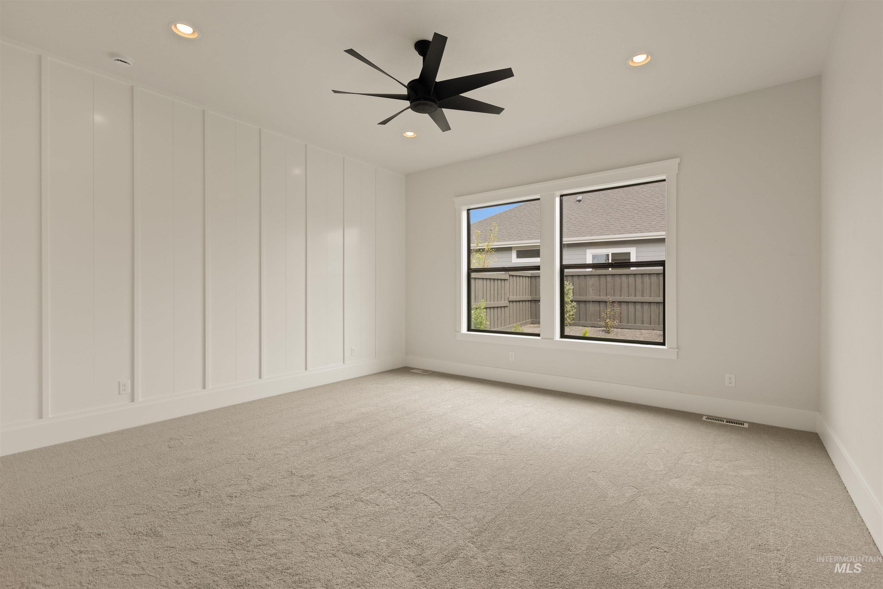 2595 East Tenzing Drive Meridian, ID 83642 - Photo 14 of 32 Spare room with light colored carpet, recessed lighting, and a ceiling fan