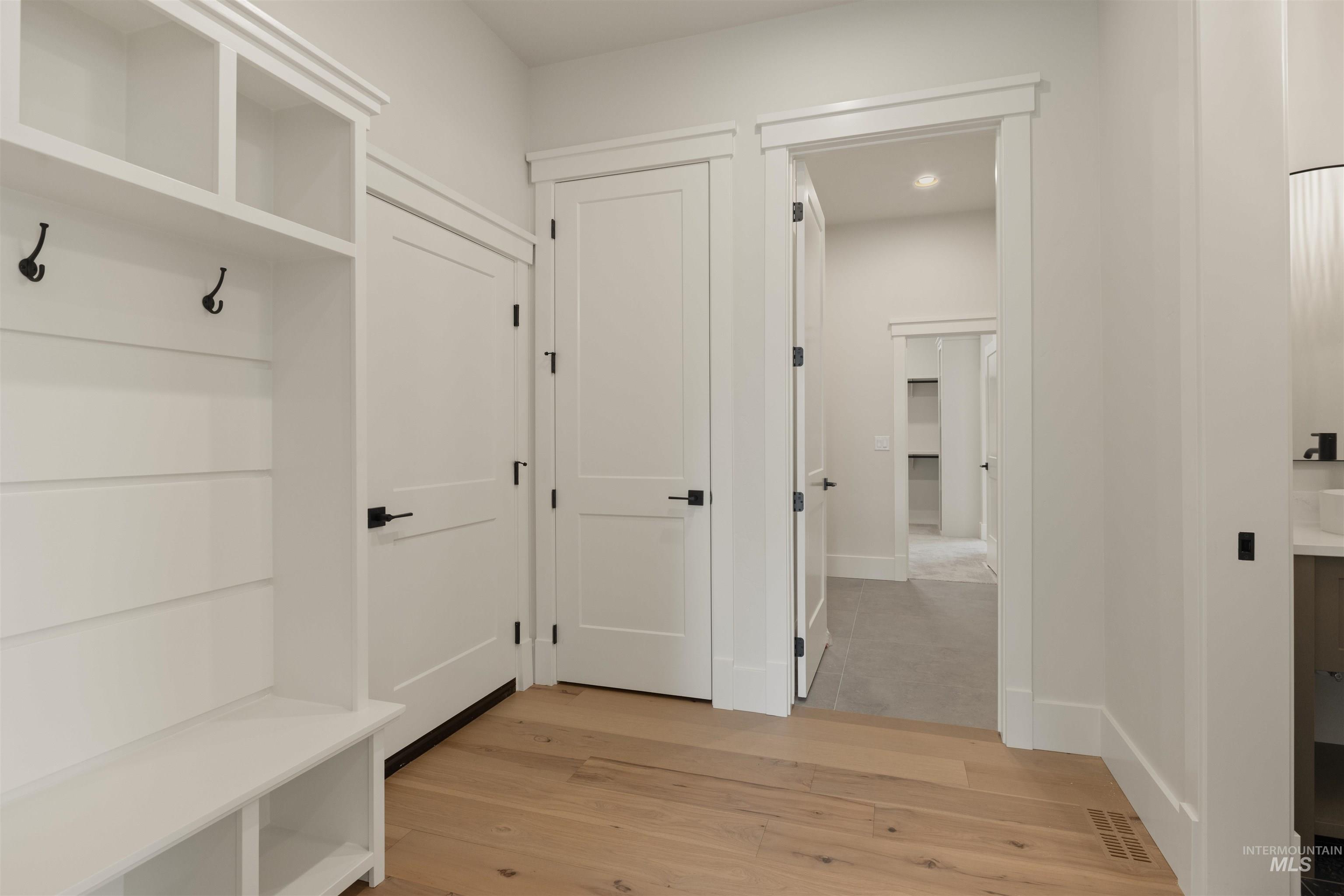 2595 East Tenzing Drive Meridian, ID 83642 - Photo 22 of 32 Mudroom featuring light wood finished floors and baseboards