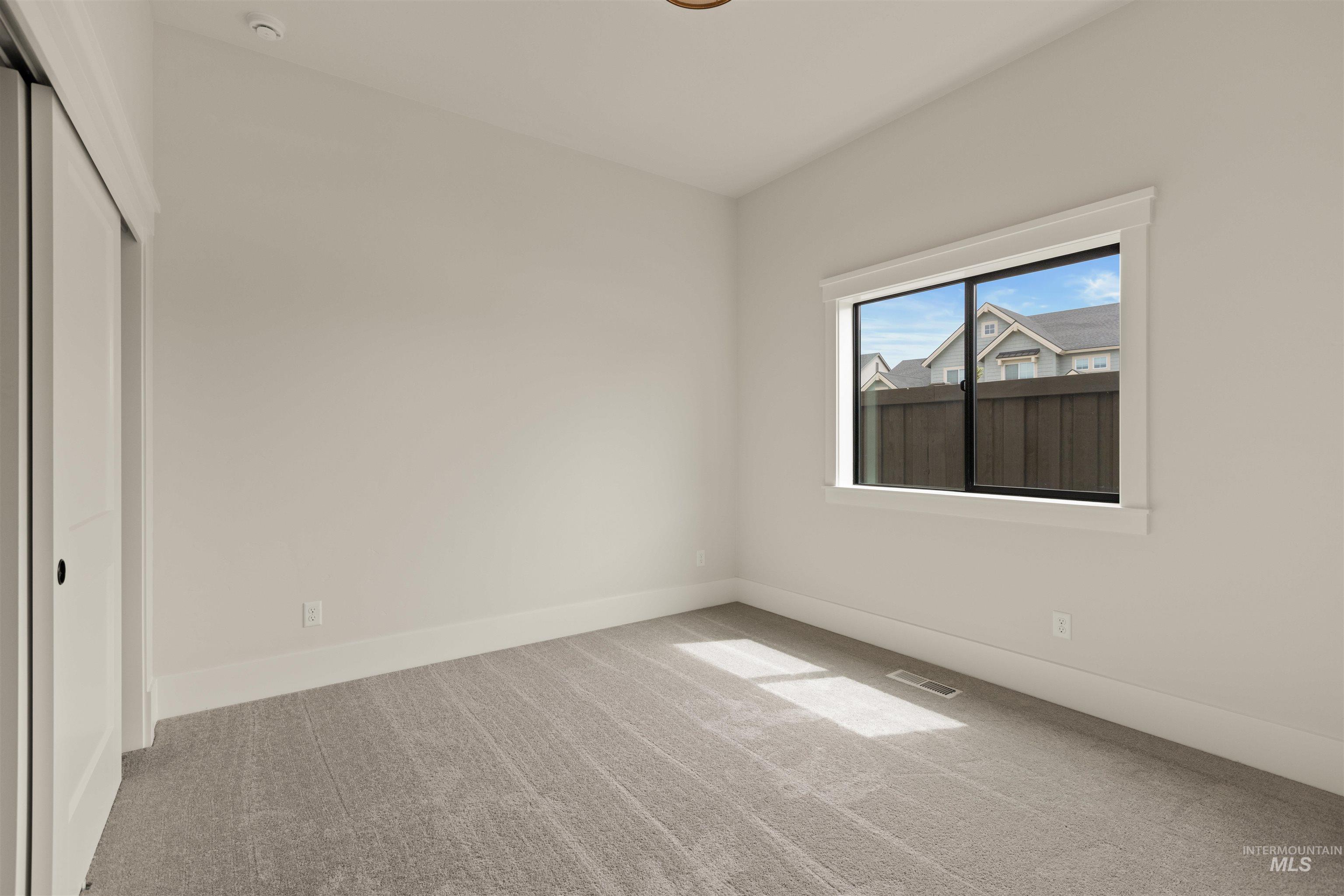 2595 East Tenzing Drive Meridian, ID 83642 - Photo 27 of 32 Unfurnished bedroom with carpet and a closet