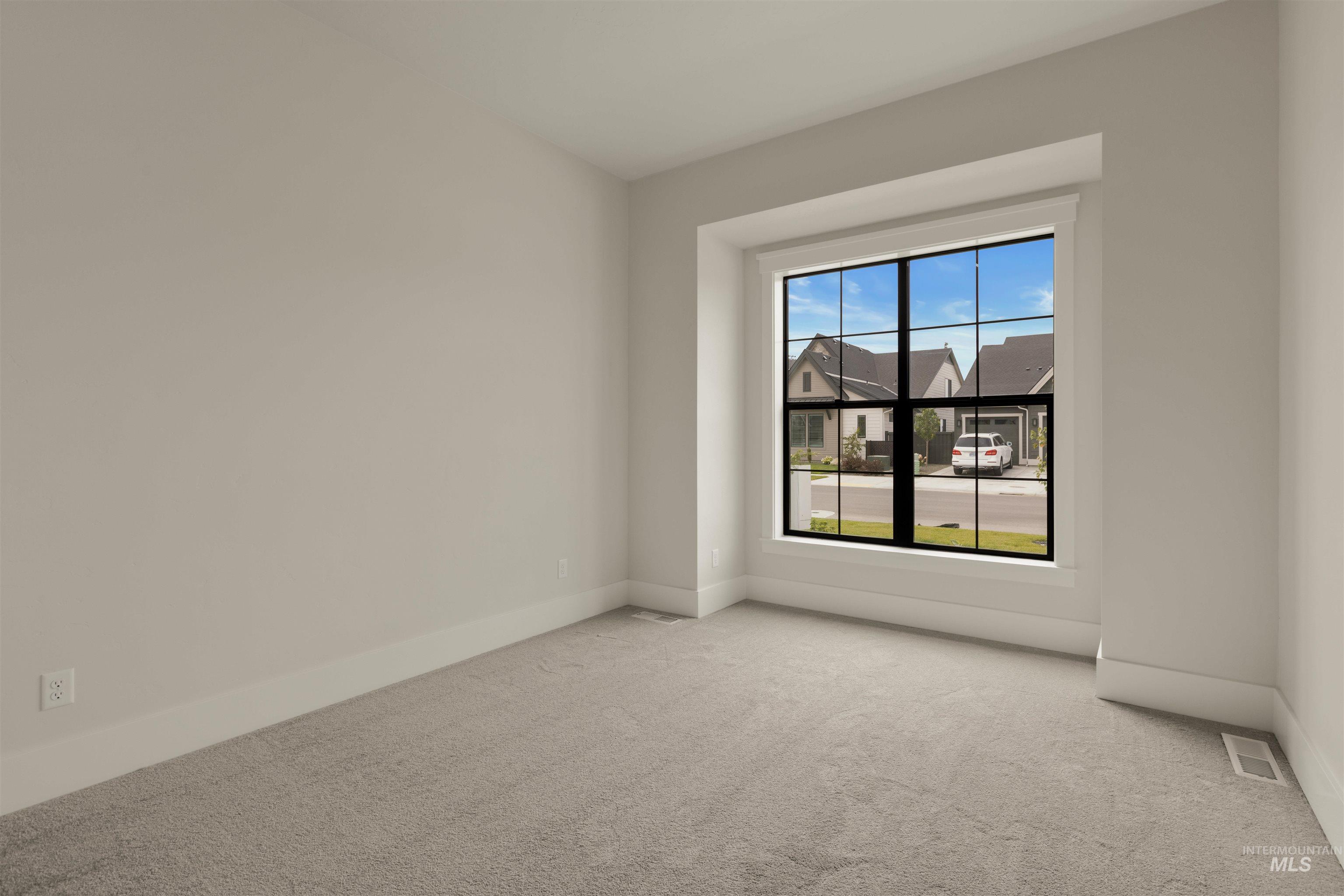 2595 East Tenzing Drive Meridian, ID 83642 - Photo 29 of 32 Carpeted spare room with baseboards